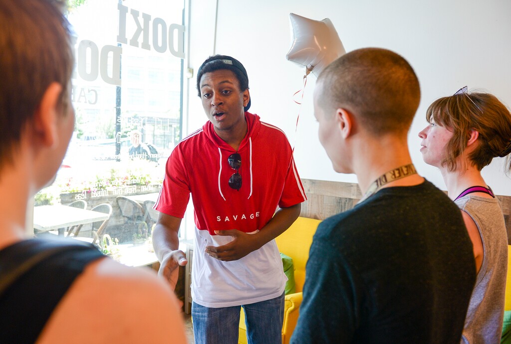 (Leah Hogsten | The Salt Lake Tribune) l-r Mason Smith, Atlas Morgan and Kae Clark showed their appreciation to Terrance Mannery with a balloon and a card that read "You Happy Up The World," Wednesday, June 6, 2018. Mannery sheltered four men leaving the Utah Pride festivities and fought off numerous would-be attackers.