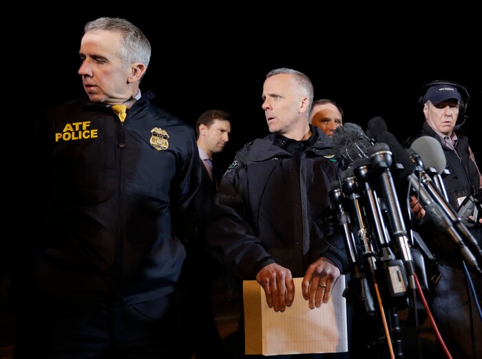 Interim Austin Police Chief Brian Manley, right, briefs the media, Wednesday, March 21, 2018, in the Austin suburb of Round Rock, Texas. The suspect in a spate of bombing attacks that have terrorized Austin over the past month blew himself up with an explosive device as authorities closed in, the police said early Wednesday. (AP Photo/Eric Gay)