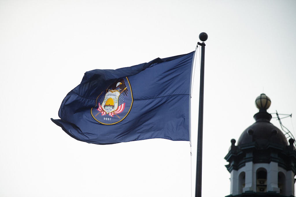 (Rachel Rydalch | The Salt Lake Tribune) The Utah flag waves in the wind and rain at the end of the legislative session on Friday, March 4, 2022.