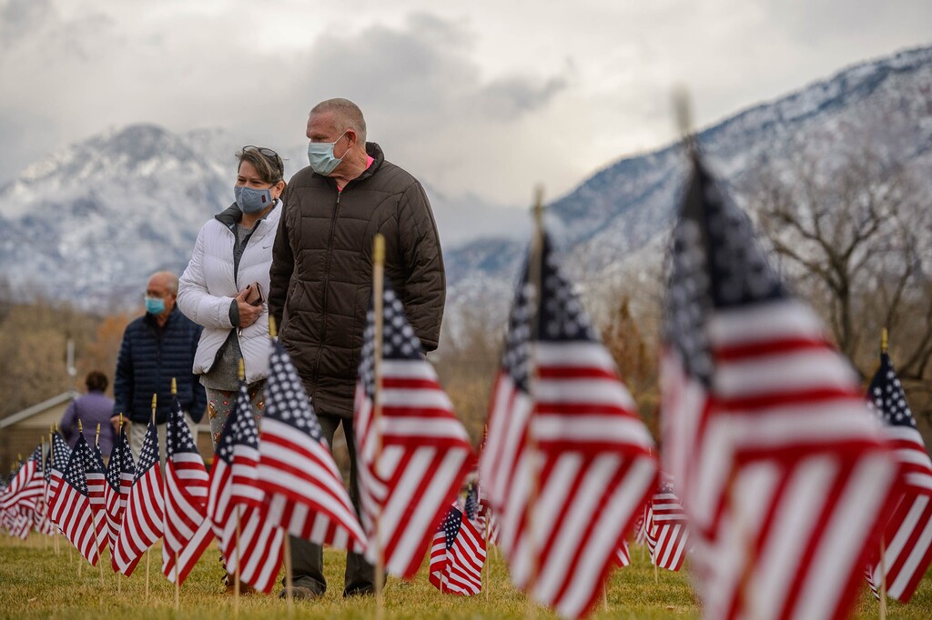 (Trent Nelson  |  The Salt Lake Tribune) Robyn and William Colbert walk through the Veterans Day Field of Flags in Draper on Wednesday, Nov. 11, 2020. William served in the Air Force from 1973-1995. At rear left are Robyn's parents Gay and Ivan Hill.