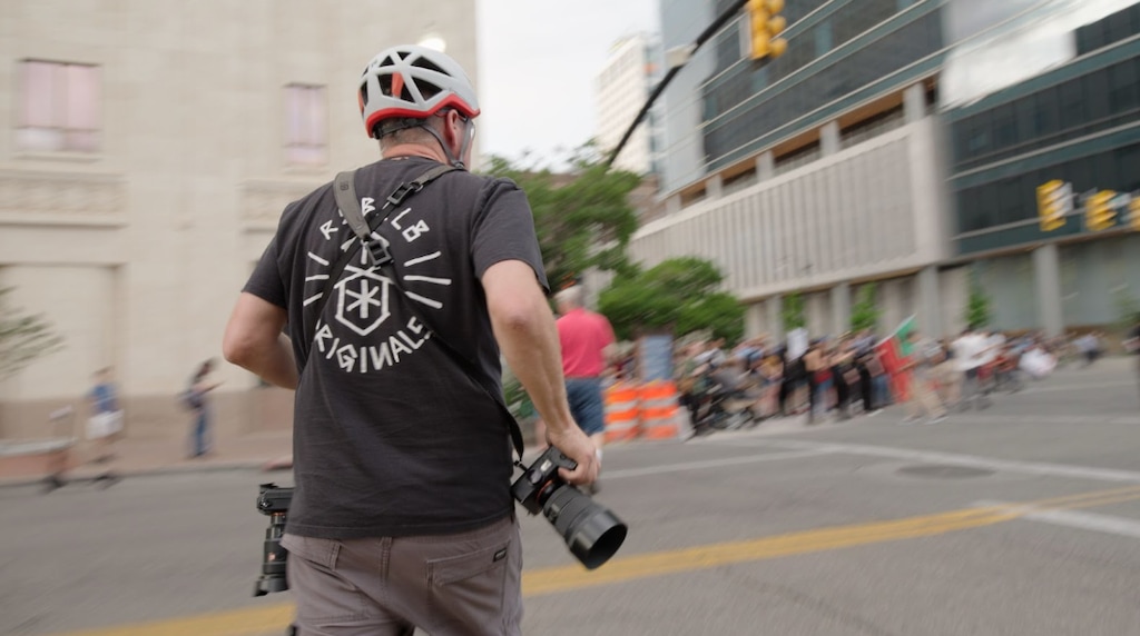 (Trevor Christensen | The Salt Lake Tribune) Visual Journalist Trent Nelson rushes to photograph the scene after shots were fired at the "No Kings" protest June 14.