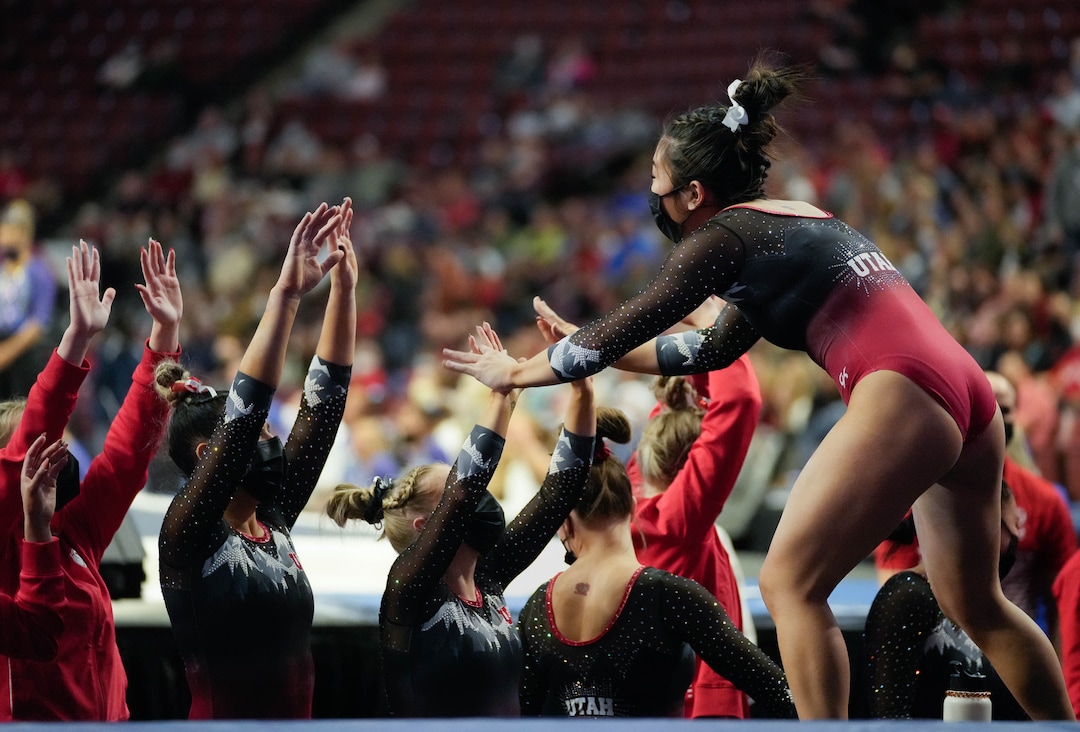 (Francisco Kjolseth | The Salt Lake Tribune) Utah’s Cristal Isa celebrates her performance on the beam with teammates at the Best of Utah NCAA Gymnastics Meet at the Maverik Center in West Valley City on Friday, Jan. 7, 2022.
