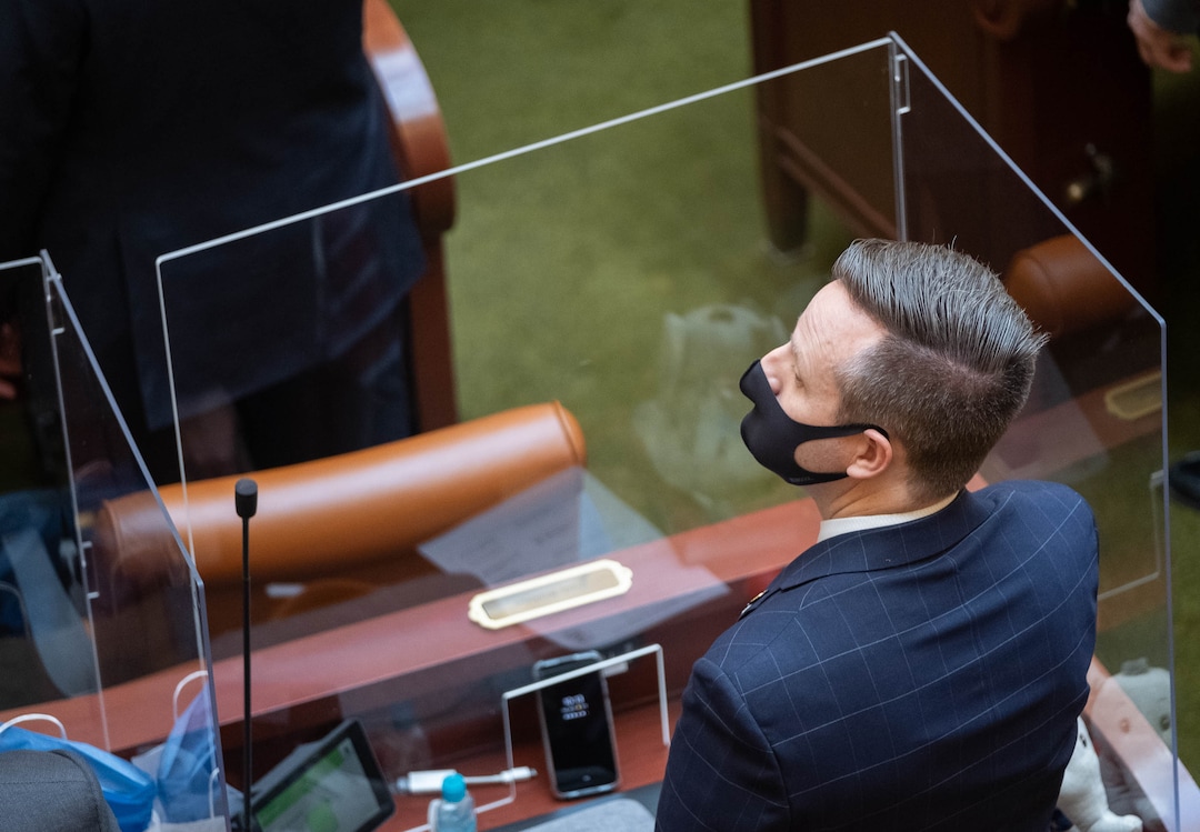 (Francisco Kjolseth  | The Salt Lake Tribune) Rep. Brady Brammer, R-Highland, wears a mask as members of the House of Representatives are separated by plexiglass during the start of the 2021 legislative session at the Capitol in Salt Lake City on Tuesday, Jan. 19, 2021.
