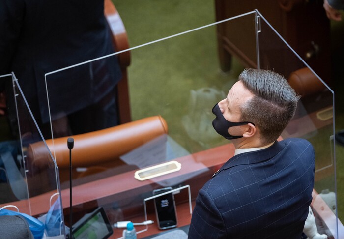 (Francisco Kjolseth  | The Salt Lake Tribune) Rep. Brady Brammer, R-Highland, wears a mask as members of the House of Representatives are separated by plexiglass during the start of the 2021 legislative session at the Capitol in Salt Lake City on Tuesday, Jan. 19, 2021.