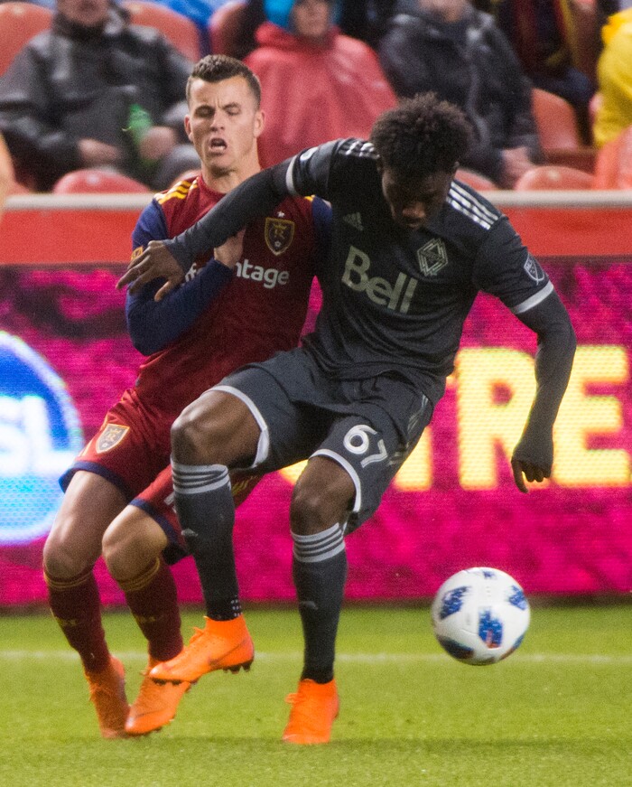 (Rick Egan  |  The Salt Lake Tribune)      Real Salt Lake forward Brooks Lennon (12) goes for the ball along with Vancouver Whitecaps forward Alphonso Davies (67), in MLS action between Real Salt Lake and Vancouver Whitecaps, at Rio Tinto Stadium beSaturday, April 7, 2018.


