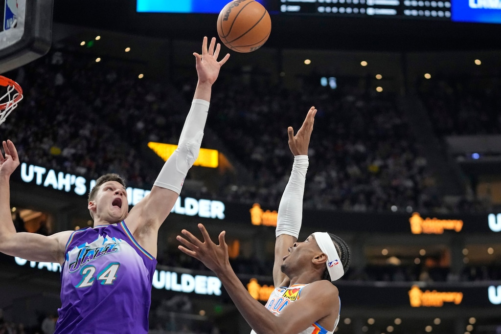 Utah Jazz center Walker Kessler (24) blocks Oklahoma City Thunder guard Shai Gilgeous-Alexander, right, shot during the first half of an NBA basketball game Thursday, Feb. 23, 2023, in Salt Lake City. (AP Photo/Rick Bowmer)