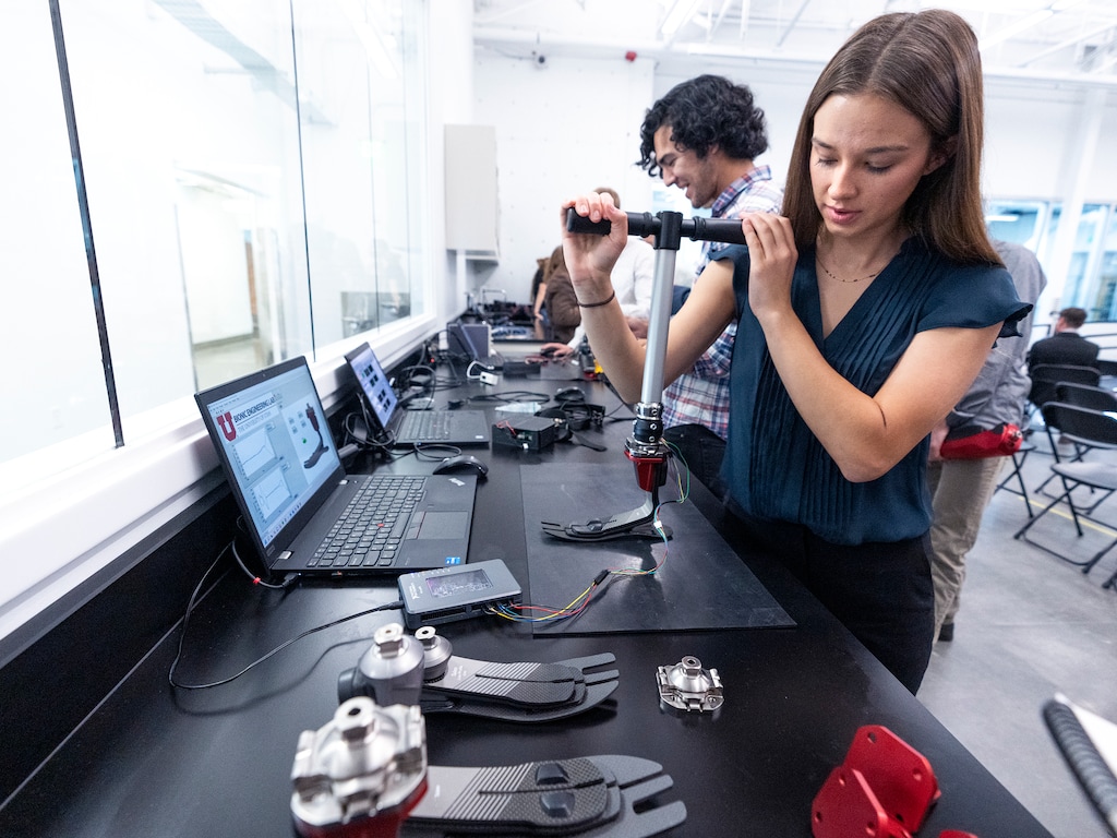 (Leah Hogsten | The Salt Lake Tribune) University of Utah bionic engineering student Marissa Cowan measures the torque and force of the instrumented pyramid of the Utah Bionic Leg, Oct. 4, 2022. The Utah Bionic Leg weighs about 6 pounds and uses motorsm processors and advanced artificial intelligence that assists users in walking, standing up, sitting down and ascending and descending stairs and ramps.