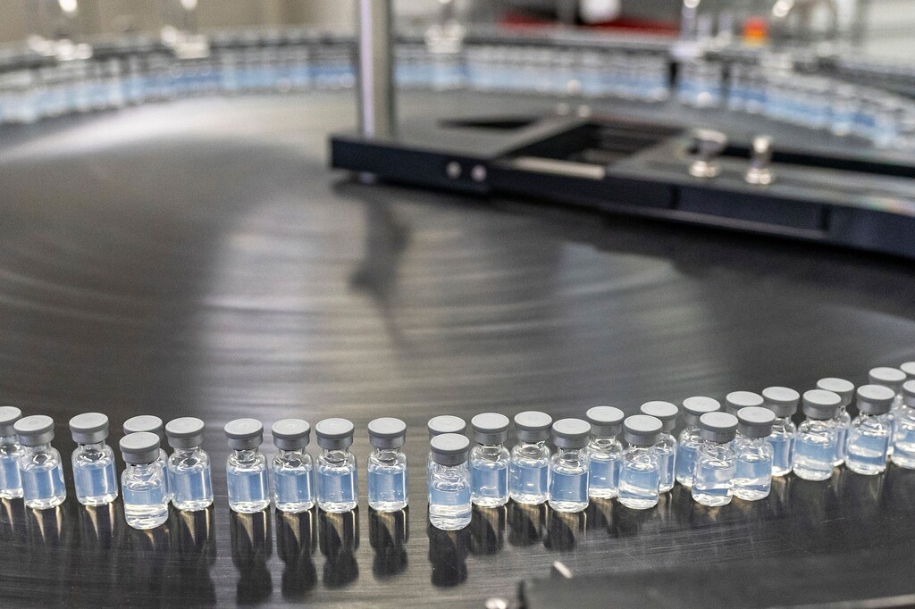 (Pfizer via AP) This August 2022 photo provided by Pfizer shows vials of the company's updated COVID-19 vaccine during production in Kalamazoo, Mich. U.S. regulators have authorized updated COVID-19 boosters, the first to directly target today's most common omicron strain. The move on Wednesday, Aug. 13, 2022, by the Food and Drug Administration tweaks the recipe of shots made by Pfizer and rival Moderna that already have saved millions of lives.