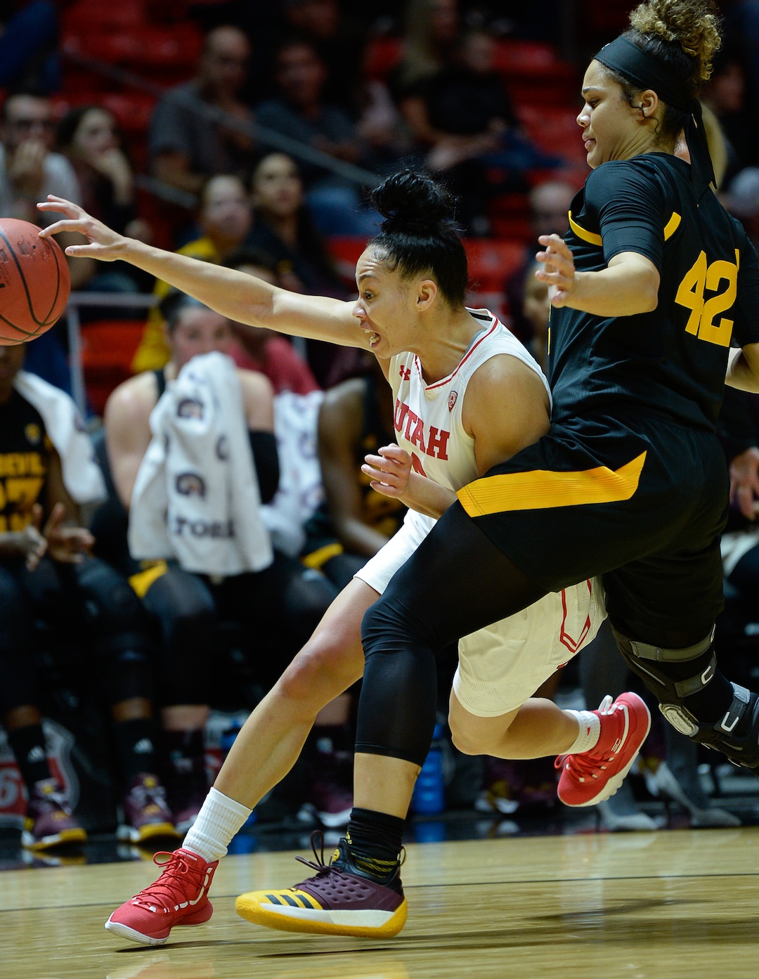 (Francisco Kjolseth  |  The Salt Lake Tribune)  Utah Utes guard Kiana Moore (0) is pressured by Arizona State Sun Devils forward Kianna Ibis (42) in Utes' Pac-12 home opener at the Jon M Huntsman Center on Friday, Jan. 4, 2019. They're off to one of their best starts in team history.