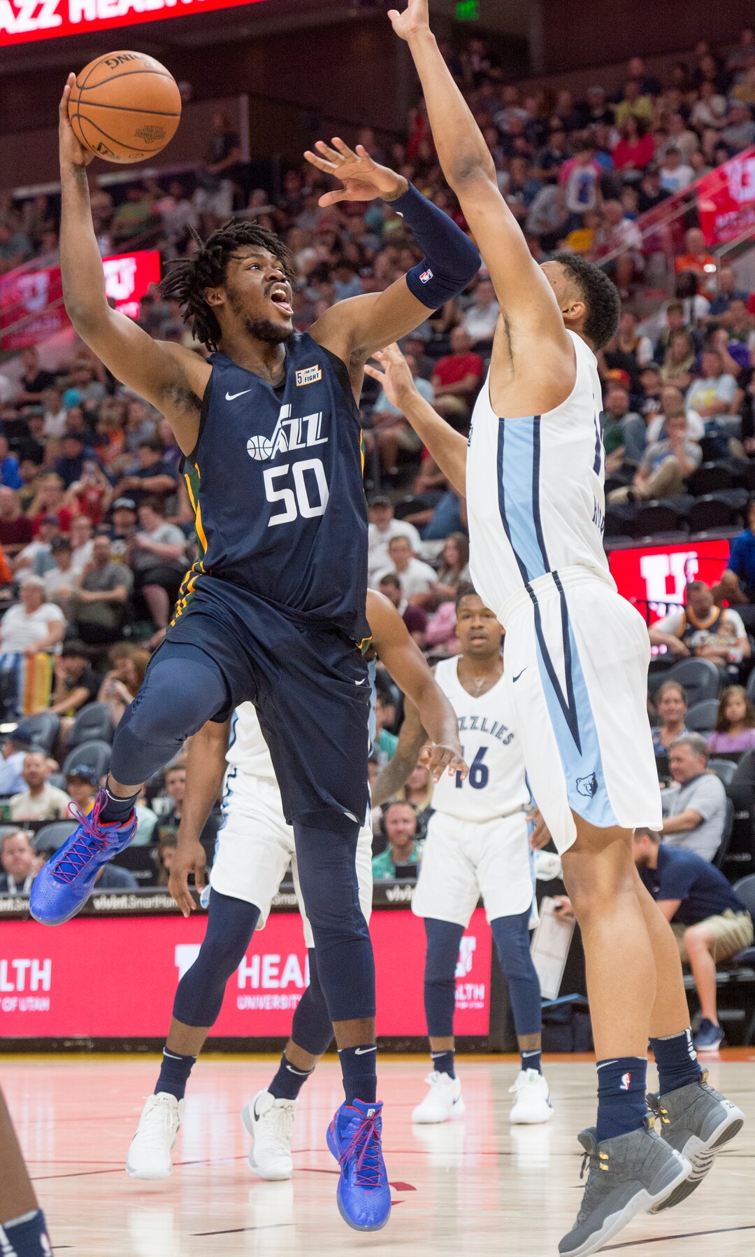 (Rick Egan  |  The Salt Lake Tribune)     Utah Jazz center Diamond Stone (50) shoots over Memphis Grizzlies forward Ivan Rabb (10) in Jazz summer league action between Utah Jazz and Memphis Grizzlies in Salt Lake City, Tuesday, July 3, 2018.