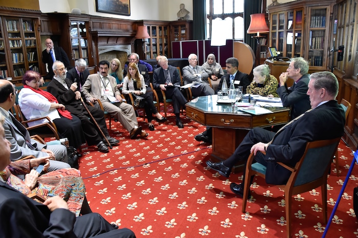 (The Church of Jesus Christ of Latter-day Saints) Elder Jeffrey R. Holland, right, addresses a conference at Windsor Castle in England in 2016.