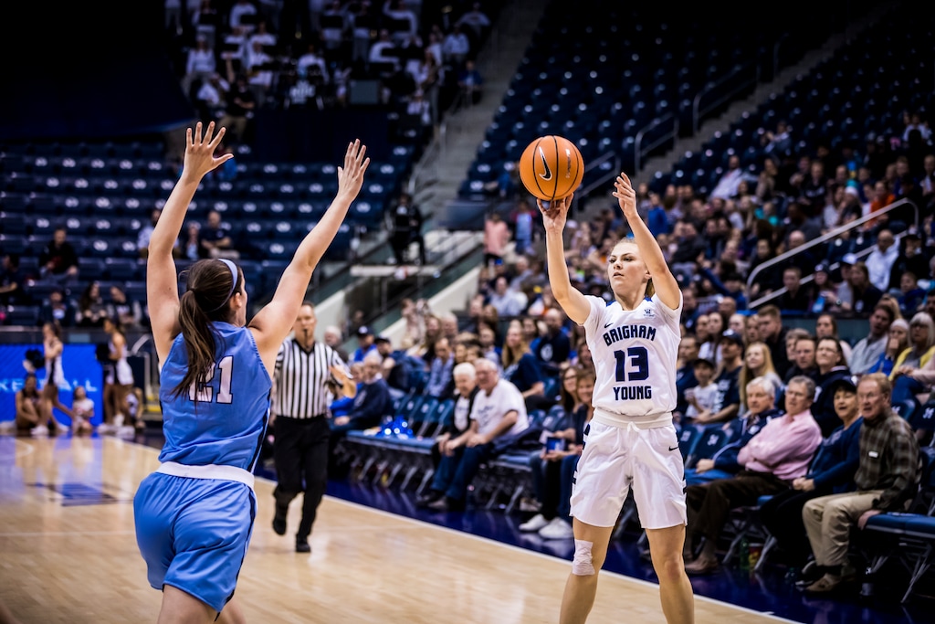(Photo courtesy of Jaren Wilkey, BYU photo) BYU guard Paisley Johnson attempts a shot against San Diego in the Marriott Center on Feb. 17, 2019.
