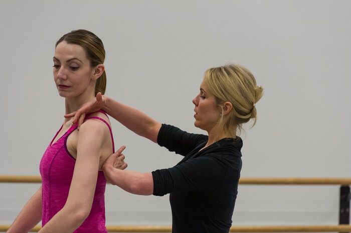 (Alex Gallivan  |  Special to the Tribune)  Ballet instructor Nikki Bybee helps a student with her form during the adult class at the Ballet West Academy in Salt Lake City, Wednesday, Jan. 31.