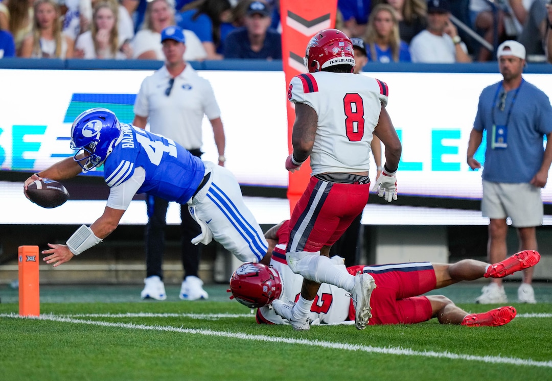 (Francisco Kjolseth | The Salt Lake Tribune) BYU Cougars quarterback Bear Bachmeier (47) scores a touchdown during the first half of an NCAA college football game against Utah Tech, Saturday, Sept. 5, 2026, at LaVell Edwards Stadium in Provo.