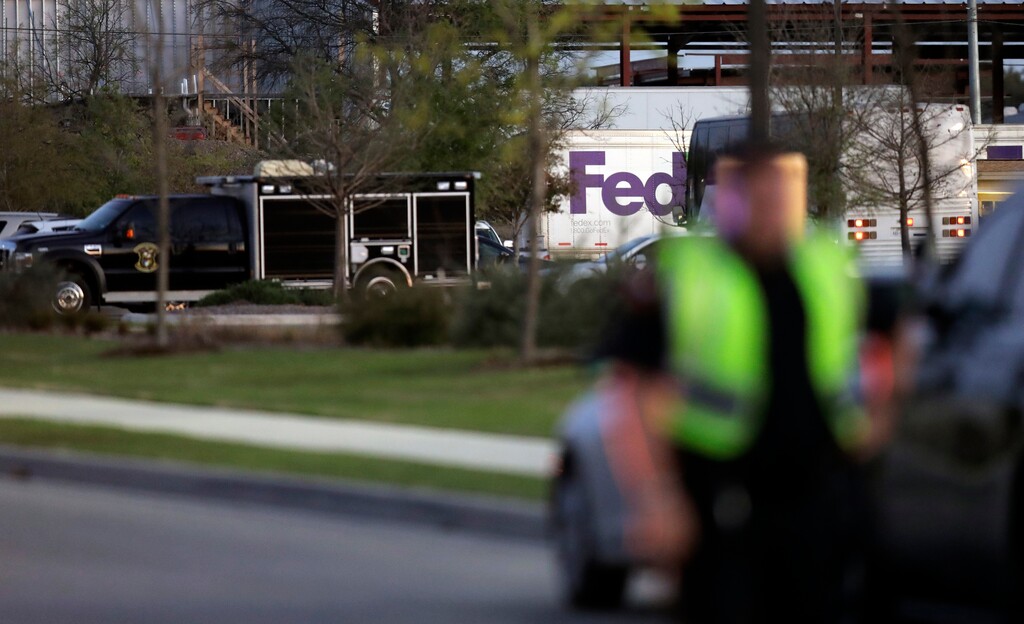 (Eric Gay | The Associated Press) Emergency vehicles sit in front of a FedEx distribution center where a package exploded, Tuesday, March 20, 2018, in Schertz, Texas. Authorities believe the package bomb is linked to the recent string of Austin bombings.