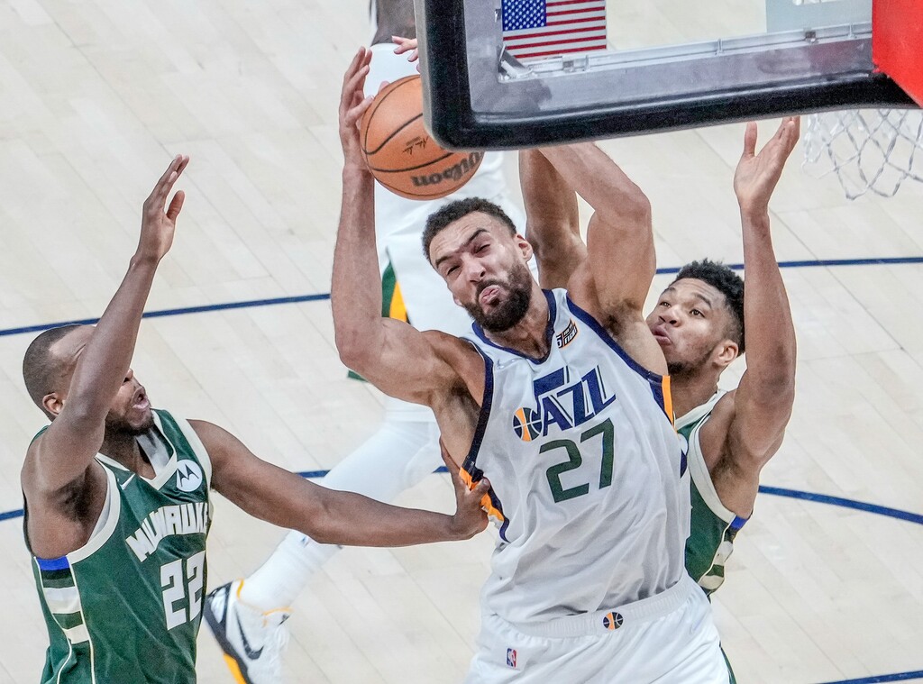 (Leah Hogsten | The Salt Lake Tribune) Utah Jazz center Rudy Gobert (27) fights for the rebound as the Utah Jazz host the Milwaukee Bucks at Vivint Arena, Mar. 14, 2022.