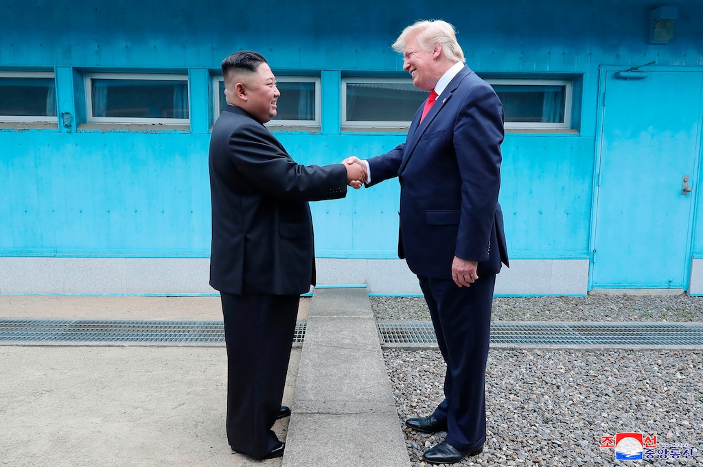 (Korean Central News Agency | Korea News Service | AP) In this Sunday, June 30, 2019, photo provided by the North Korean government, North Korean leader Kim Jong Un, left, and U.S. President Donald Trump shake hands over the military demarcation line at the border village of Panmunjom in Demilitarized Zone. The content of this image is as provided and cannot be independently verified. Korean language watermark on image as provided by source reads: "KCNA" which is the abbreviation for Korean Central News Agency.