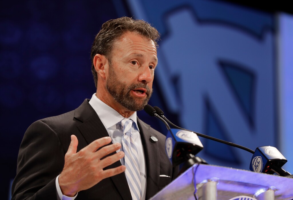 North Carolina head coach Larry Fedora answers a question during a news conference at the NCAA Atlantic Coast Conference college football media day in Charlotte, N.C., Wednesday, July 18, 2018. (AP Photo/Chuck Burton)