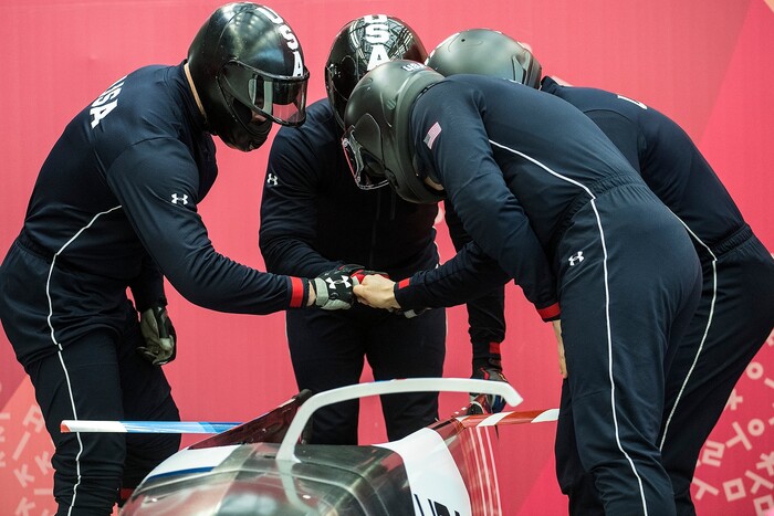 (Chris Detrick  |  The Salt Lake Tribune)  USA's Justin Olsen, Nathan Weber, Carlo Valdes and Chris Fogt huddle during the 4-man Official Training at Olympic Sliding Centre during the Pyeongchang 2018 Winter Olympics Wednesday, Feb. 21, 2018. 