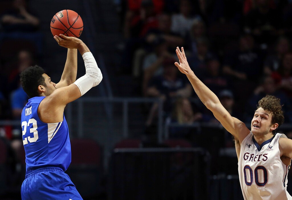 Saint Mary's Tanner Krebs (00) defends a shot from BYU's Yoeli Childs during the first half of a West Coast Conference tournament NCAA college basketball game, Monday, March 5, 2018, in Las Vegas. (AP Photo/Isaac Brekken)