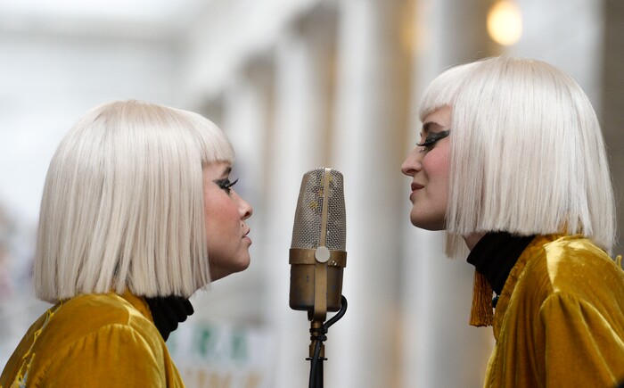 (Leah Hogsten | The Salt Lake Tribune) Lead singers with Lucius, l-r Holly Laessig and Jess Wolfe inspired the crowd at Amplifying WomenÕs Voices rally to celebrate International WomenÕs Day at the Utah State Capitol Rotunda, hosted by KRCL Thursday, March 8, 2018.