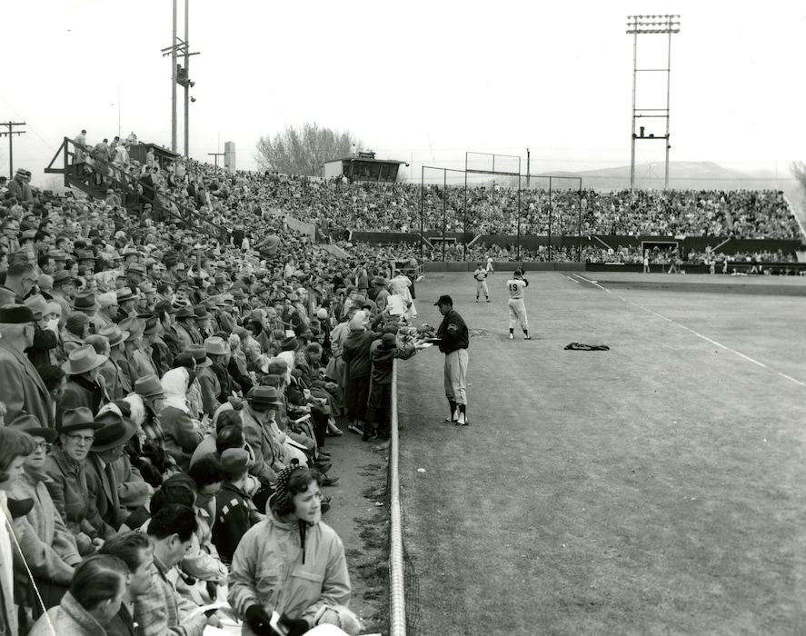 Tribune file photoA player signs autographs for fans at Derk's Field is seen in this undated photo.