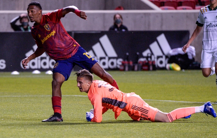 (Leah Hogsten  |  The Salt Lake Tribune) Real Salt Lake forward Douglas Martinez (12) and Portland Timbers goalkeeper Aljaz Ivacic (31) watch Martinez's goal as Real Salt Lake hosts the Portland Timbers, Oct. 14, 2020.