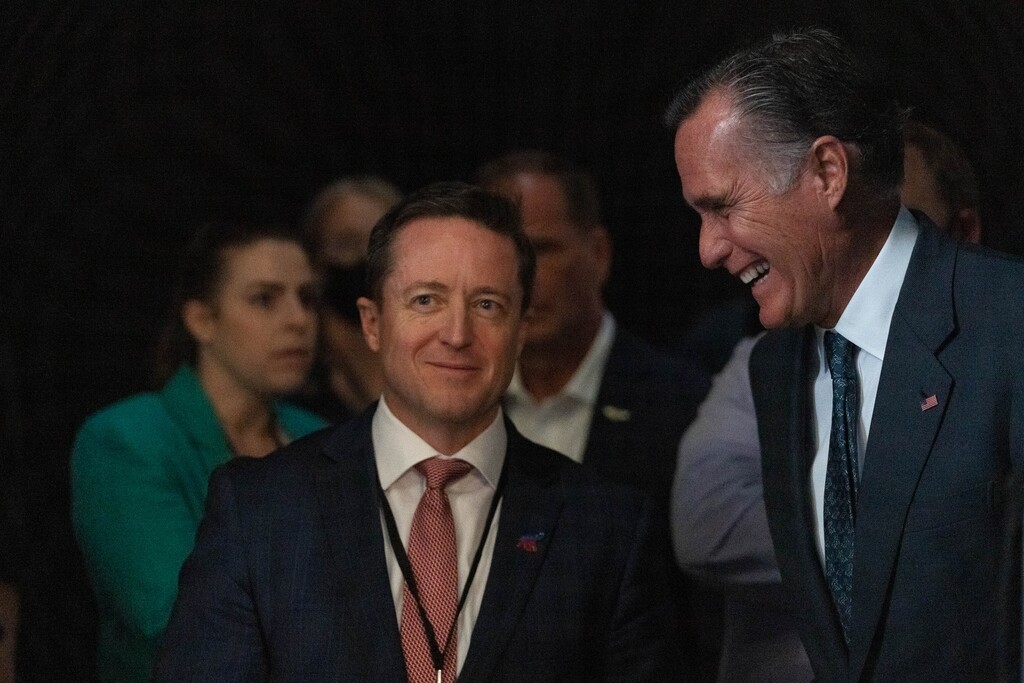 (Francisco Kjolseth | The Salt Lake Tribune) Sen. Mitt Romney, left, speaks with outgoing Utah Republican Chairman Derek Brown before Romney took the stage during the Utah Republican Party’s 2021 Organizing Convention at the Maverik Center in West Valley City on Saturday, May 1, 2021, where he was booed by Republican delegates numbering more than 1,900. 
