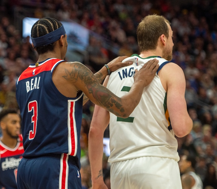(Rick Egan  |  The Salt Lake Tribune)     Washington Wizards guard Bradley Beal (3) rubs Utah Jazz guard Joe Ingles shoulders after he was fouled, in NBA action between the Utah Jazz and the Washington Wizards, in Salt Lake City, Friday, February 28, 2020