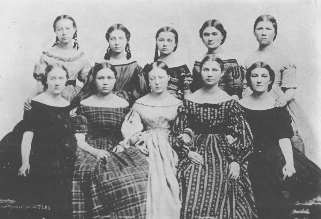 (Church History Library) Ten of Brigham Young’s daughters, photographed in 1865. As social leaders in the Latter-day Saint community, these young women were positioned to lead the new junior retrenchment movement, which eventually grew into the faith's global Young Women program.