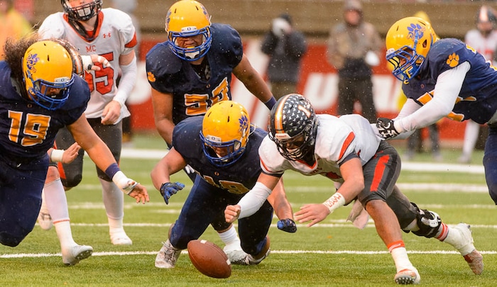 (Trent Nelson | The Salt Lake Tribune)  Mountain Crest's Brady Hall (1) dives to recover his own fumble as Orem faces Mountain Crest in the Class 4A High School State Football Championship game in Salt Lake City, Friday November 17, 2017.