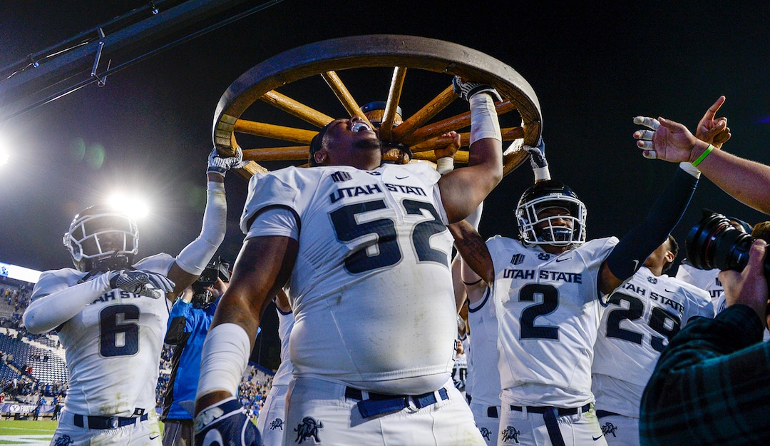 Leah Hogsten  |  The Salt Lake Tribune   Utah State Aggies celebrate the win after defeating BYU, 45-20, at Lavell Edwards Stadium in Provo, Friday, Oct. 5, 2018.
