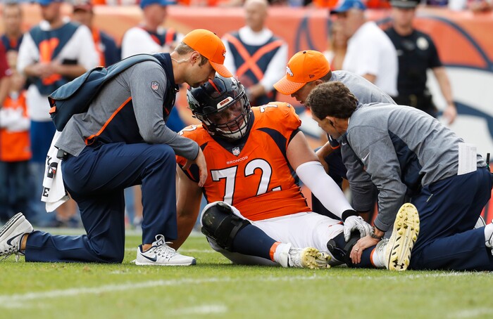 Denver Broncos offensive tackle Garett Bolles (72) is helped after an injury against the Dallas Cowboys during the second half of an NFL football game, Sunday, Sept. 17, 2017, in Denver. (AP Photo/Joe Mahoney)