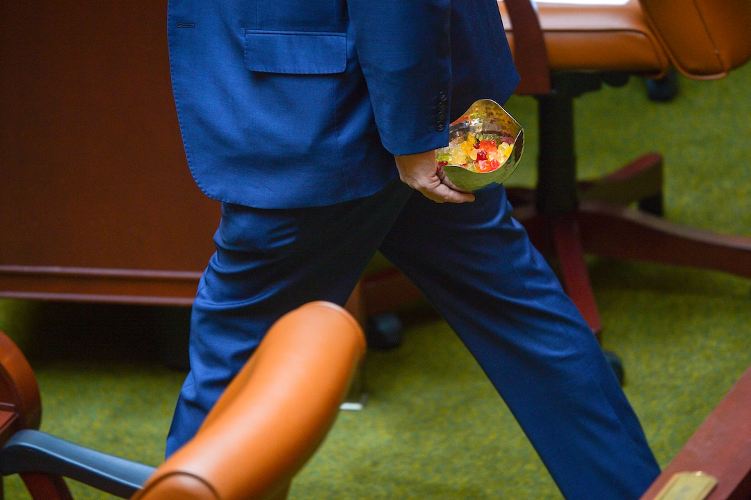 (Leah Hogsten  |  The Salt Lake Tribune)  State Sen. Jim Dabakis walks through the Utah House chamber with a bowl of candy gummy bears that look similar to marijuana-infused edibles that he offered to fellow legislators. Utah legislators voted to change the Utah Medical Cannabis Act, the bill that officials, Prop 2 opponents and medical marijuana advocates crafted and pitched as a compromise. On Monday, Dec. 2, 2018 during the special session, lawmakers overhauled the medical cannabis distribution system, reduces the number of medical marijuana outlets, prohibits edibles for gelatin cubes instead and changes the list of illnesses that qualify for cannabis treatments.