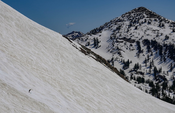 (Francisco Kjolseth  | The Salt Lake Tribune) Skiers hit Mineral Basin as Snowbird closes the book on the 2024-25 ski season on Monday, May 26, 2025. Snow and sun revelers took to the slushy slopes on Memorial Day as the resort was the last in the state to close.