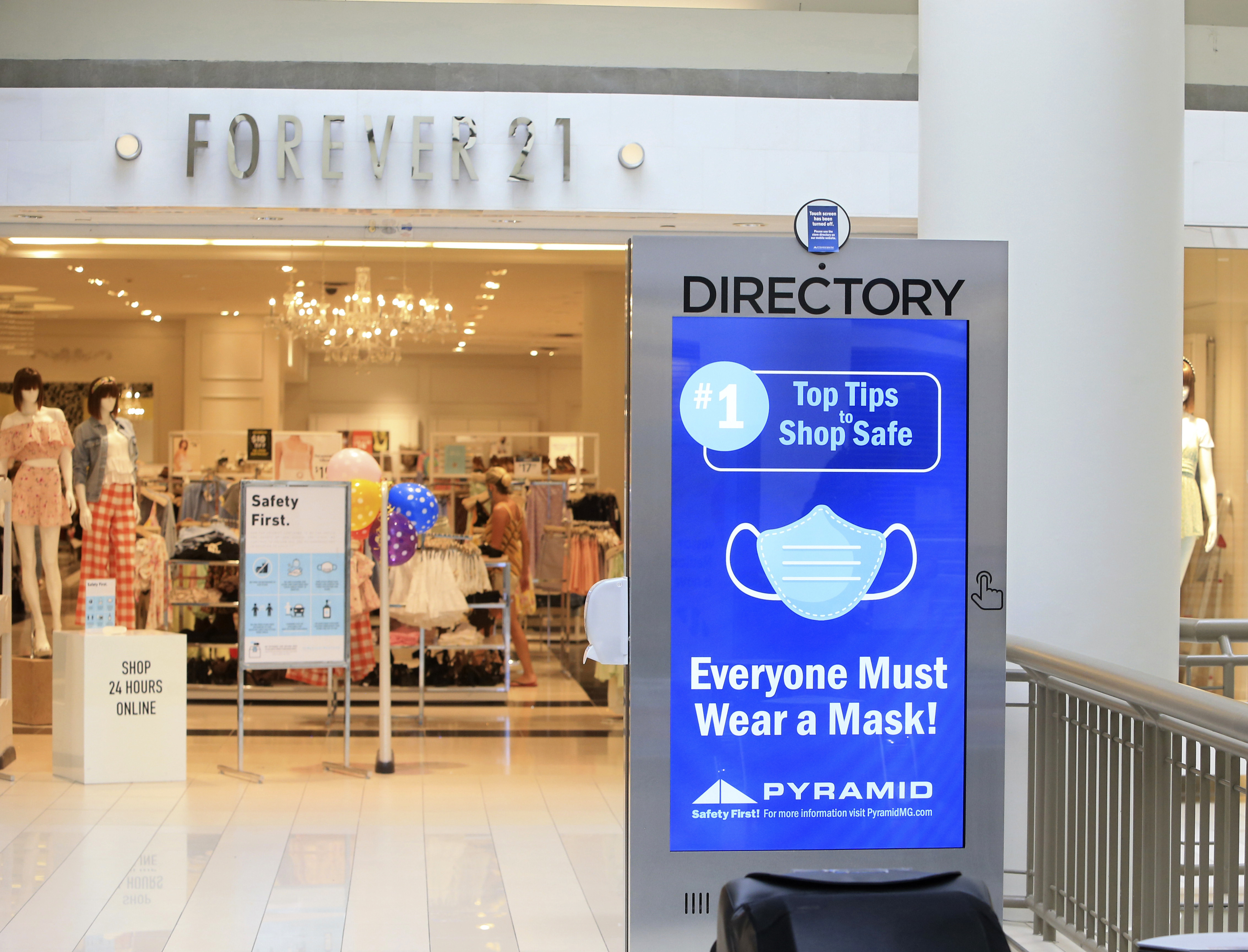 (Patrick Oehler | The Journal via AP file photo)  A sign on mask usage covers the disabled interactive directory display at the Poughkeepsie Galleria mall in Poughkeepsie, N.Y., Friday, July 10, 2020.