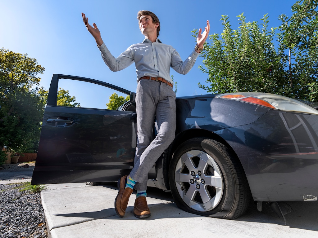 (Leah Hogsten | The Salt Lake Tribune)  Nate Blouin, a democratic candidate for Utah Senate District 13, talks on Friday after someone stole an election sign from his yard and deflated two tires on the family car overnight.