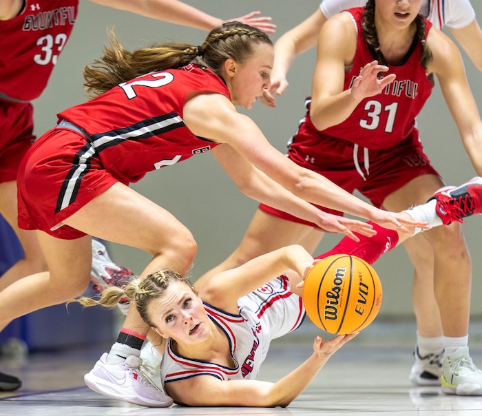 (Rick Egan | The Salt Lake Tribune) Springville Red Devil guard Ellie Esplin (1) tries to pass the ball as Bountiful Redhawks Ellyse Kessler (12) and Milika Satuala (31) defend, in the Girls 5A State Championship between the Springville Red Devils and the Bountiful Redhawks, at Weber State, on Saturday, March 4, 2023.
