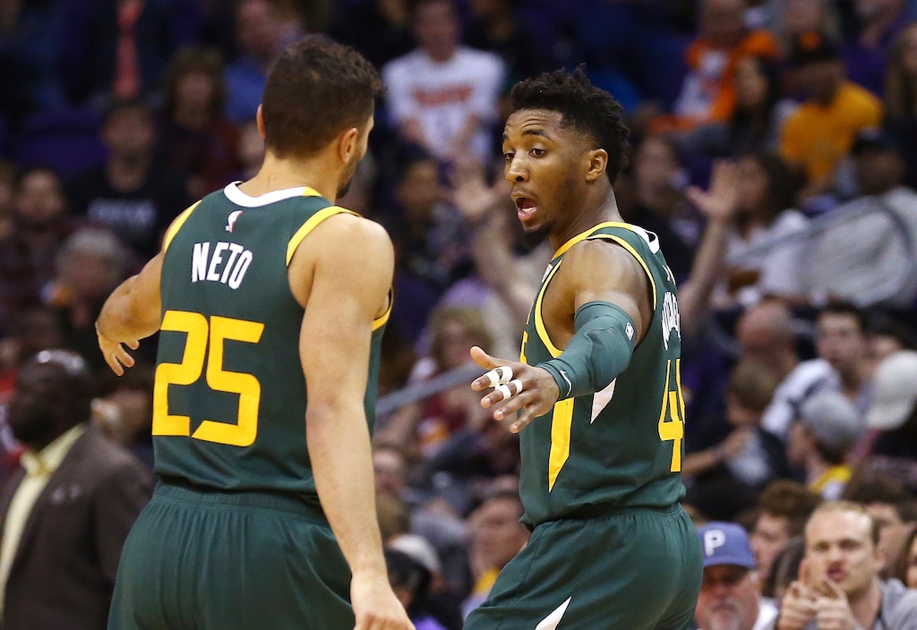 Utah Jazz guard Donovan Mitchell, right, celebrates his 3-pointer against the Phoenix Suns with Jazz guard Raul Neto (25) during the second half of an NBA basketball Wednesday, April 3, 2019, in Phoenix. The Jazz won 118-97. (AP Photo/Ross D. Franklin)