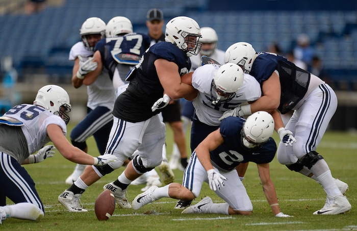 (Francisco Kjolseth  |  The Salt Lake Tribune)  Austin Kafentzis fumbles the ball as BYU holds a scrimmage at LaVell Edwards Stadium in Provo on Thursday, Aug. 10, 2017.