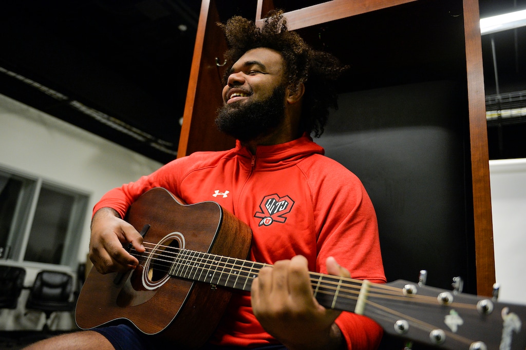 (Chris Samuels | The Salt Lake Tribune) Utah center Nick Ford strums his guitar at the Spence and Cleone Eccles Football Center, Thursday, Oct. 21, 2021. Ford plays multiple instruments, including piano and ukulele.