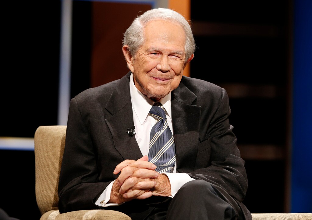 (Steve Helber | AP file photo) Rev. Pat Robertson poses a question to a Republican presidential candidate during a forum at Regent University in Virginia Beach, Va., Oct. 23, 2015. Robertson, a religious broadcaster who turned a tiny Virginia station into the global Christian Broadcasting Network, tried a run for president and helped make religion central to Republican Party politics in America through his Christian Coalition, has died. He was 93. Robertson's death Thursday, June 8, 2023 was announced by his broadcasting network.