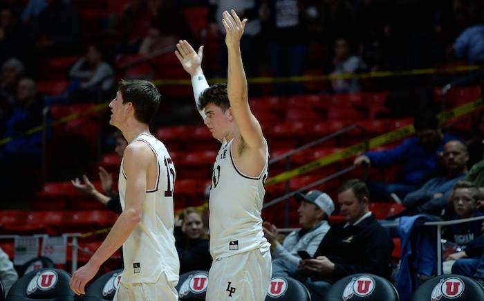 (Francisco Kjolseth  |  The Salt Lake Tribune)  Davis vs Lone Peak, 6A State high school basketball tournament at the Huntsman Center in Salt Lake City, Thursday March 1, 2018. Lone Peak celebrates their win over Davis. 