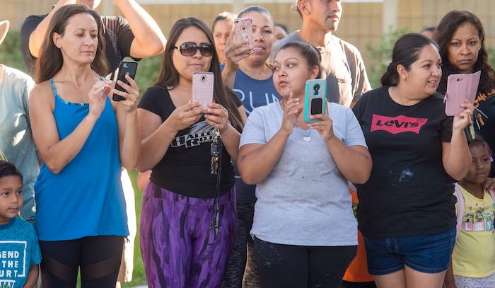 (Rick Egan | The Salt Lake Tribune) Parents line up to take photos of their children as they walk the red carpet on the first day of school at Copperview Elementary School in Midvale, Monday, Aug. 19, 2019.