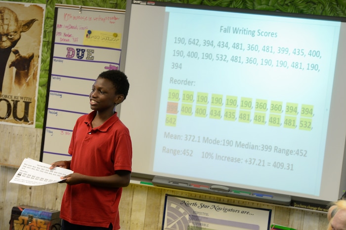 (Francisco Kjolseth  |  The Salt Lake Tribune)  Antwone Moore, 12, presents the increase in SAGE test scores and how they used statistics and probability to raise their scores along with a little incentive. Sharon Moore, 6th grade teacher at North Star Elementary agreed to dye her hair during class on Tuesday, May 8, 2018. This was the incentive that got her kids' scores up nearly 17 percent.