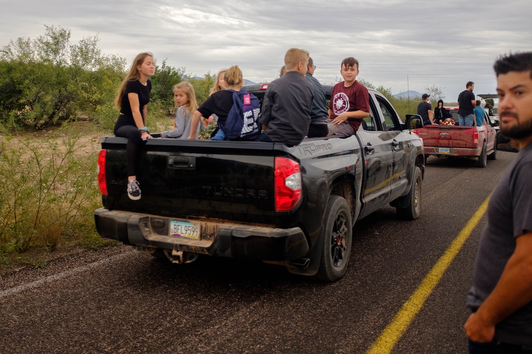 (Trent Nelson  |  The Salt Lake Tribune)Children ride in a truck with the remains of the Miller children, who were killed by gunman, en route to a funeral in Colonia LeBaron, Chihuahua on Friday Nov. 8, 2019. The Miller children are Howard Jacob Jr., 12; Krystal Bellaine, 10; Titus Alvin Miller, 8 months; and his twin sister, Tiana Gricel.
