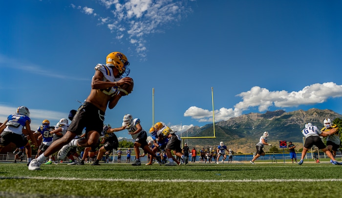 (Leah Hogsten | The Salt Lake Tribune) Orem High School football team quarterback, Micah Fe'A, August 8, 2019.