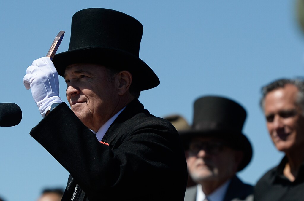 (Francisco Kjolseth  |  The Salt Lake Tribune)  Governor Gary Herbert holds up a copper spike on Friday May 10, 2019, in celebration of the 150th anniversary of the completion of the transcontinental railroad at Promontory Summit where the two rails met back on May 10, 1869.