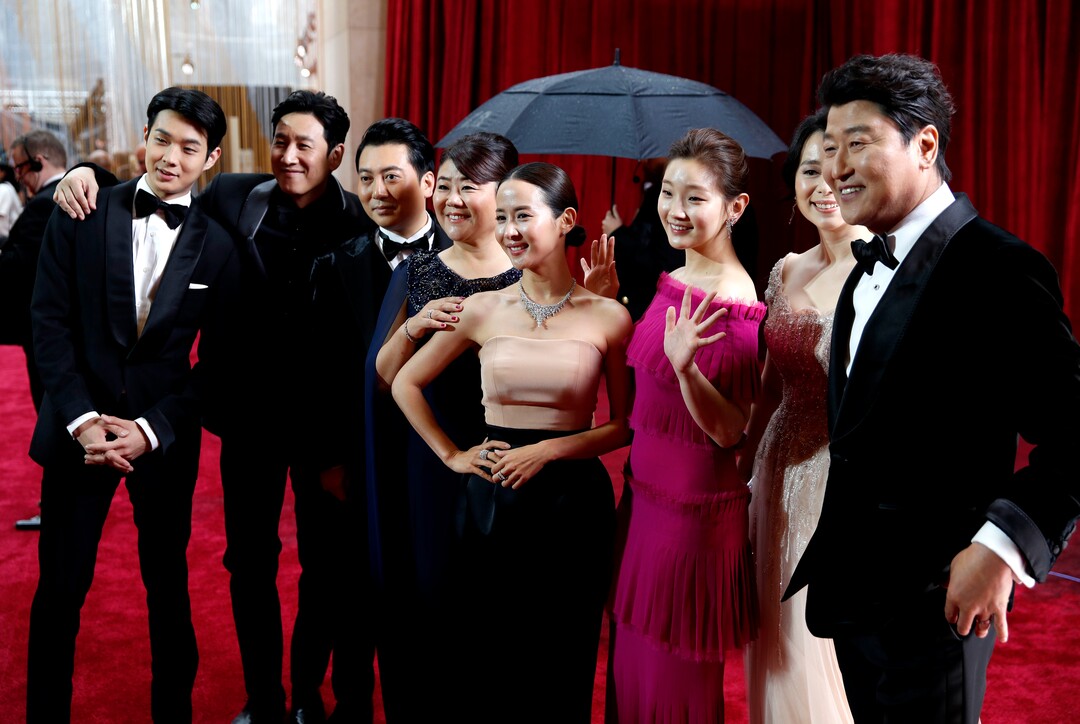 (John Locher | AP)  The cast of "Parasite" arrives at the Oscars on Sunday, Feb. 9, 2020, at the Dolby Theatre in Los Angeles.