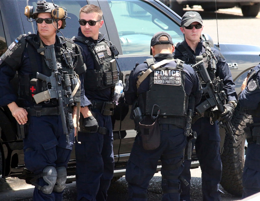(Rudy Gutierrez | The Associated Press)
U.S. Customs and Border Protection officers gather near the scene of a shooting at a shopping mall in El Paso, Texas, on Saturday, Aug. 3, 2019. Multiple people were killed and one person was in custody after a shooter went on a rampage at a shopping mall, police in the Texas border town of El Paso said.